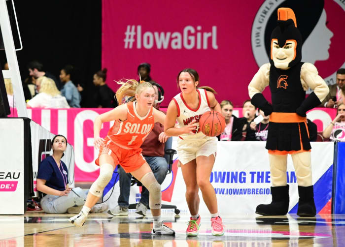 Solon's Kobi Lietz (left) defends Estherville Lincoln Central's Jasey Anderson (right) during the Class 3A state championship game at Wells Fargo Arena in Des Moines on Friday. (Photo by Ryan Timmerman)